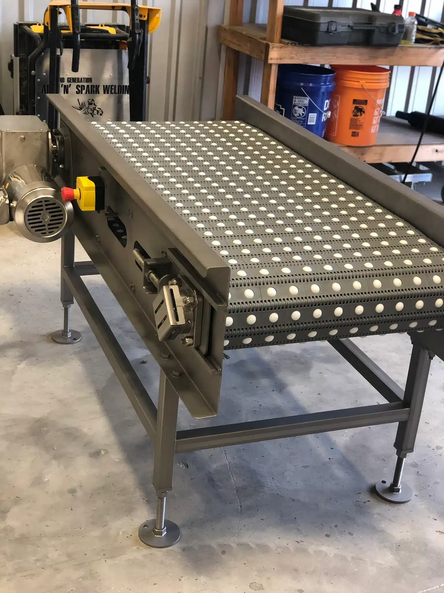 Custom food-service conveyor fabricated by Second Generation Arc 'N' Spark