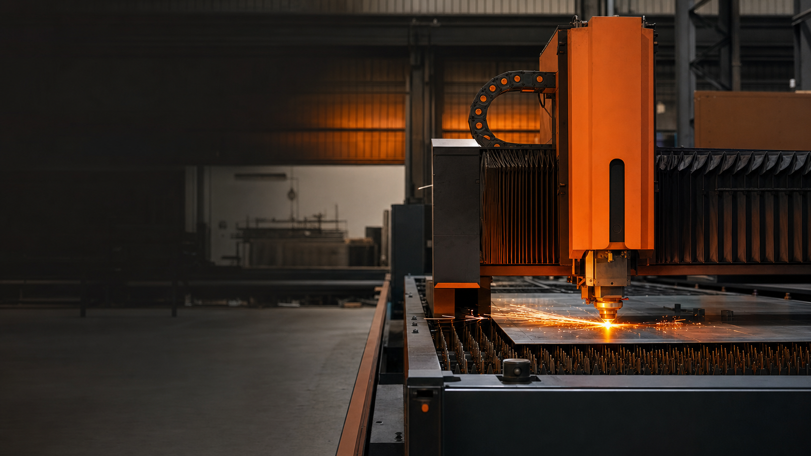 Precision laser cutting on a steel fabrication bed